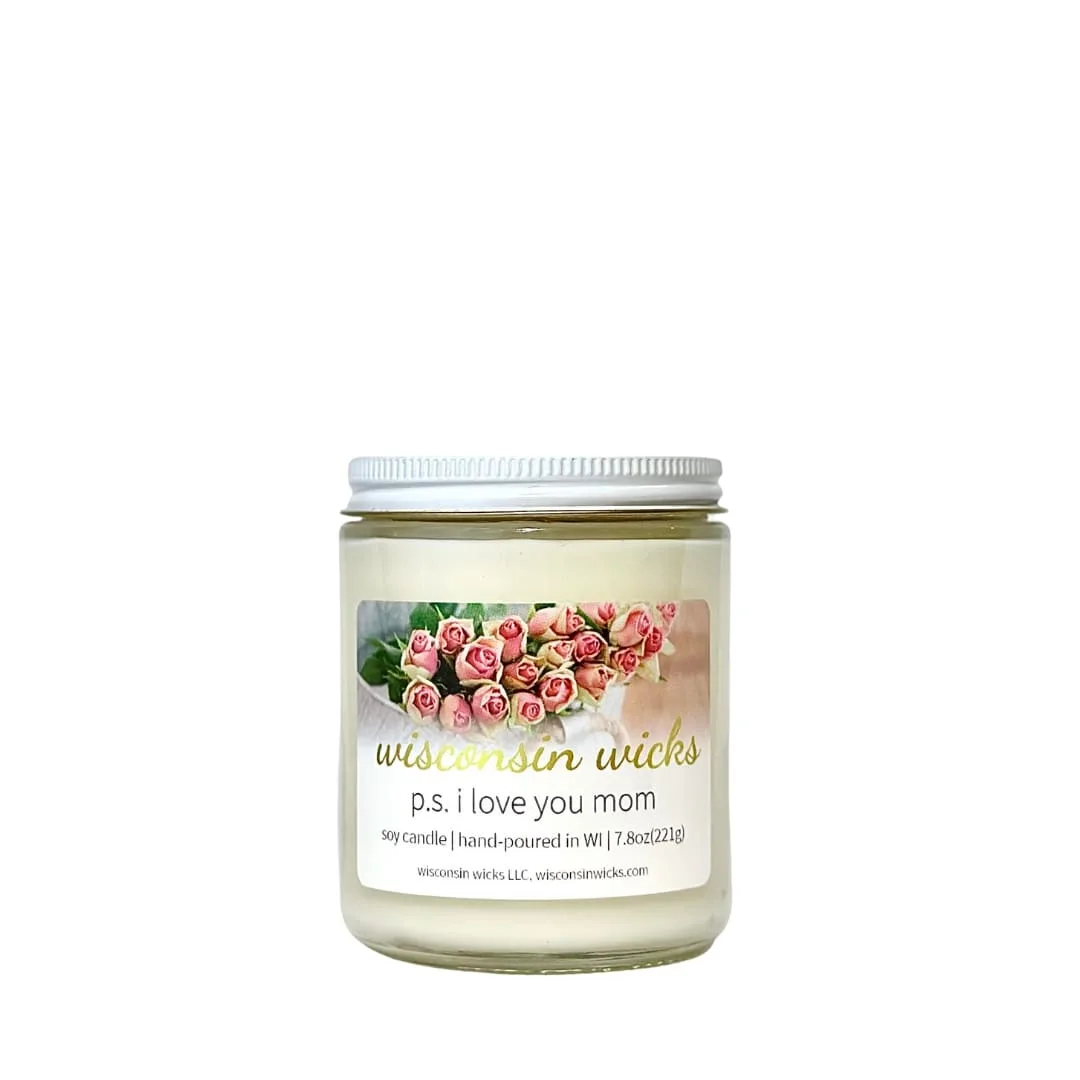 Floral candle with white screw-top lid adorned with a label featuring visuals of a flower bouquet against a white backdrop